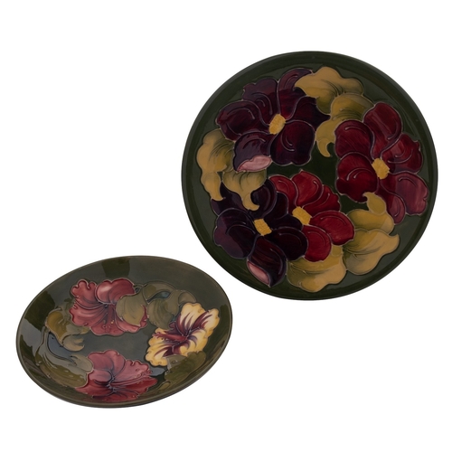 147 - A William Moorcroft 'Hibiscus' footed bowl and a similar 'Anemone' dish both with impressed  marks '... 