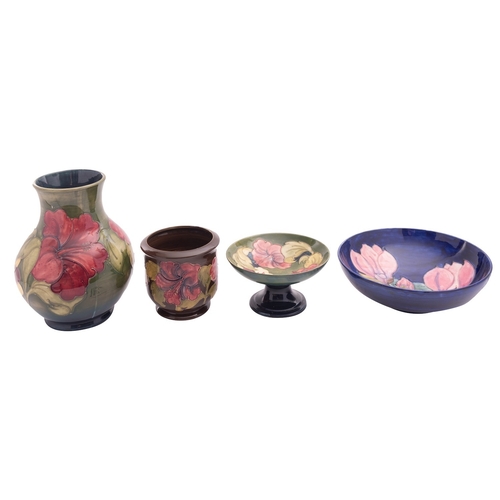 149 - Four pieces of Walter and John Moorcroft pottery comprising a vase, planter and comport tube lined i... 