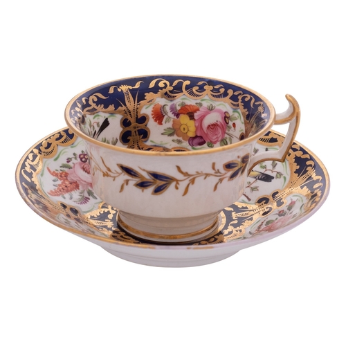 173 - A Coalport teacup and saucer in London shape, painted in pattern 759 with birds and flowers reserved... 