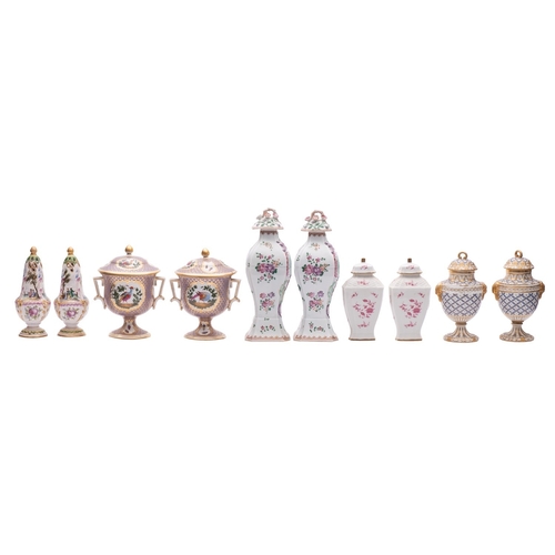 215 - A mixed lot of Continental ceramics comprising a pair of Sevres-style vases and covers with blue and... 