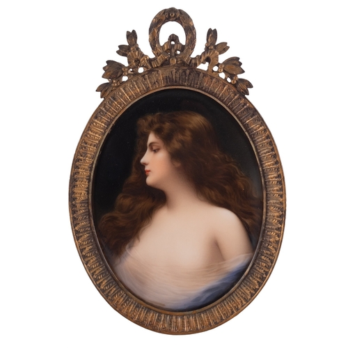 223 - A Dresden porcelain oval plaque painted with a female half portrait in a diaphanous top, 14cm high, ... 