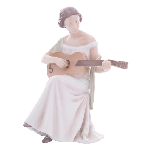 225 - A Bing & Grondahl porcelain figure, Woman with Guitar, modelled after  the original by Irminger, pri... 