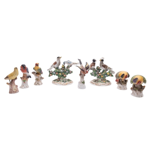 236 - A pair of German porcelain bocage bird groups together with two  pairs of single bird figures and tw... 