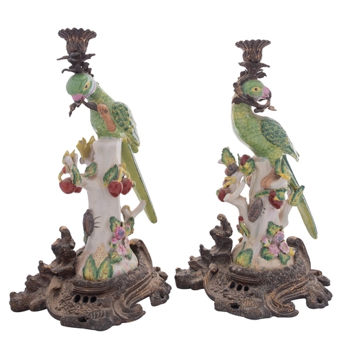 240 - A pair of reproduction ceramic and gilt-metal mounted parrot candlesticks, 37cm.