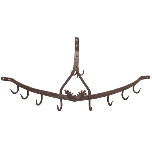 265 - A wrought iron wall mounting game crown, 19th century; of demi-lune form the raised central bar with... 