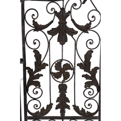 278 - A patinated metal openwork twin fold screen, second half 20th century; with scrolling acanthus cast ... 