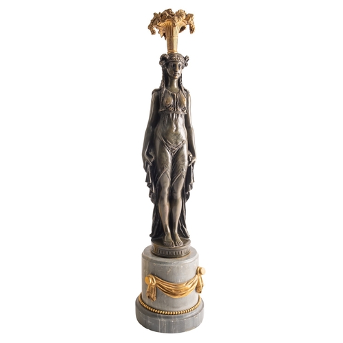 359 - A Continental bronze and marble mounted figural candelabrum stand, 19th century; modelled as a stand... 