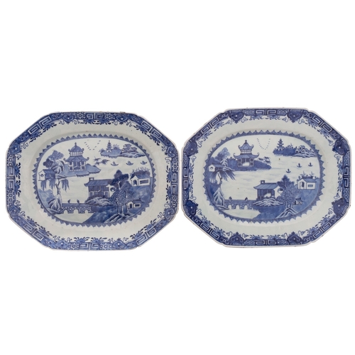 36 - A pair of Chinese blue and white octagonal meat dishes painted with pagoda lake landscapes with two ... 