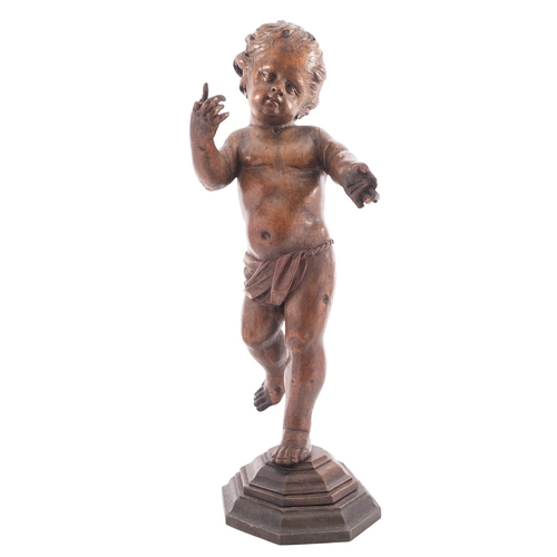 394 - A Continental carved limewood model of a putto, probably Austro-German, early 19th century; portraye... 