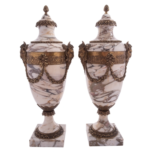 395 - A pair of gilt metal mounted marble side urns in Neoclassical taste, early 20th century; the ovoid c... 