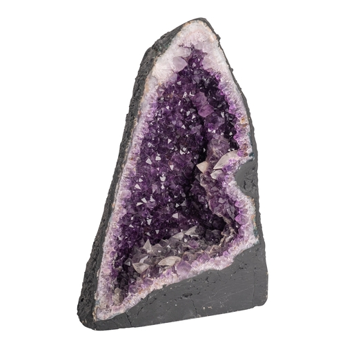 413 - A semi-cut amethyst geode, of lancet form, 33cm high, 22cm wide