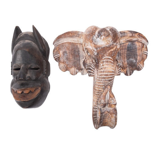 420 - An African carved softwood mask in the form of an elephant, second half 20th century, 40cm high, 40c... 