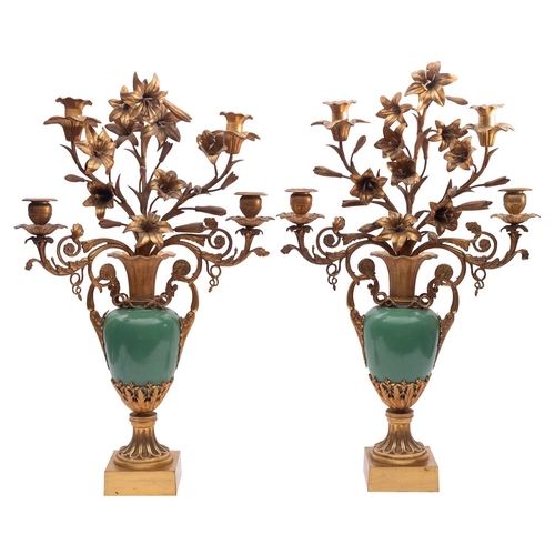 434 - A pair of French gilt bronze and green porcelain four light candelabra, late 19th century in the Lou... 