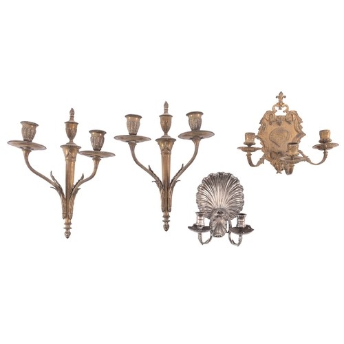 436 - A pair of gilt metal twin light wall appliques in Empire style, early 20th century; each with laurel... 