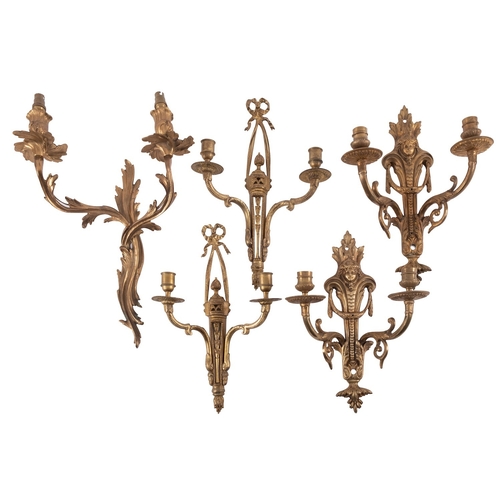 438 - A pair of gilt metal twin light wall appliques in Louis XV / XVI Transitional style, 20th century, e... 