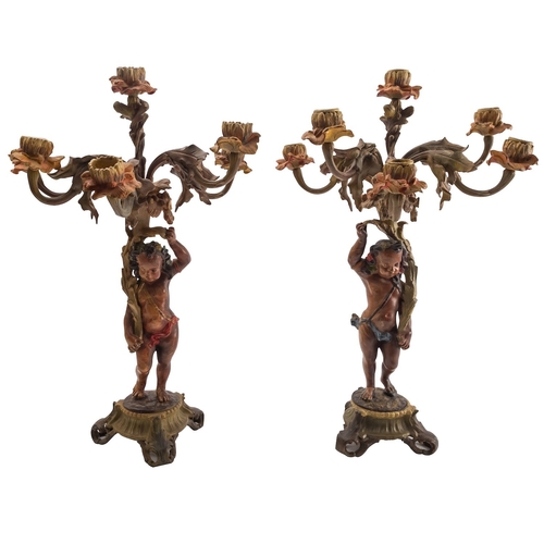 439 - A pair of bronze and later cold painted figural six light candelabra, mid 19th century; each with a ... 