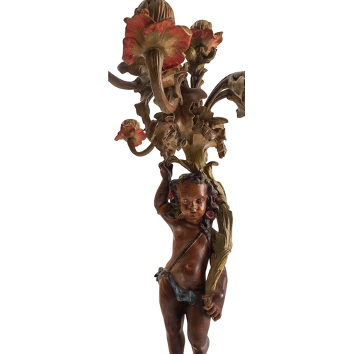 439 - A pair of bronze and later cold painted figural six light candelabra, mid 19th century; each with a ... 