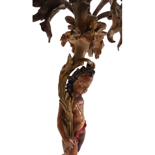 439 - A pair of bronze and later cold painted figural six light candelabra, mid 19th century; each with a ... 