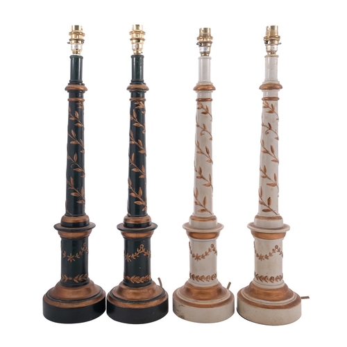 447 - Two pairs of painted and parcel gilt composition columnar table lamps, modern; with electrical fitme... 