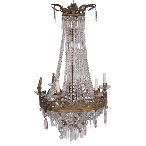 450 - A gilt metal and cut glass hung sixteen light electrolier in Regency style, early 20th century; the ... 