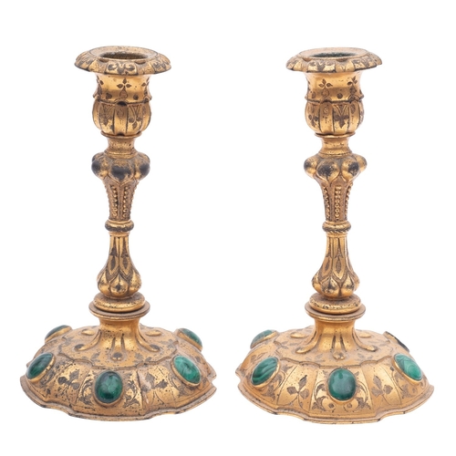 451 - A pair of gilt metal and malachite mounted candlesticks, possibly Russian, late 19th century; with f... 