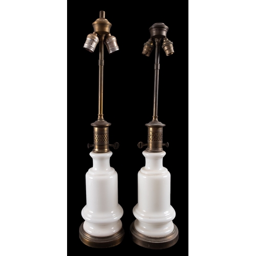 455 - A pair of milk glass and brass mounted table lamps, circa 1900 and later fitted for electricity; eac... 