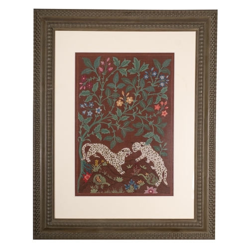 489 - An Indian crewel work panel depicting panthers in foliage, 20th century; mounted, framed and glazed;... 