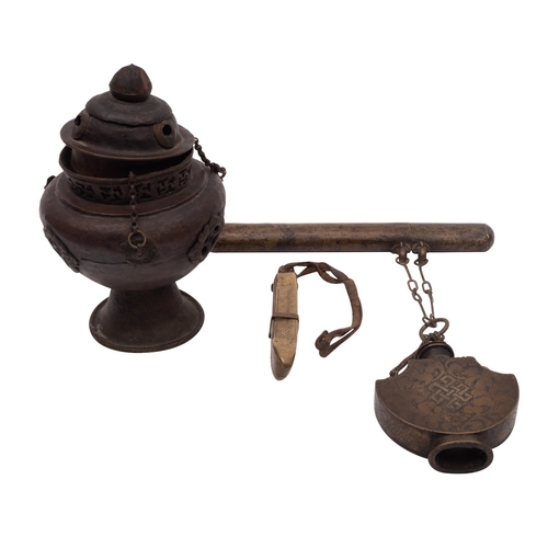 493 - A Tibetan metal hanging incense burner with cover, a similar brass tobacco box with attached pipe ho... 