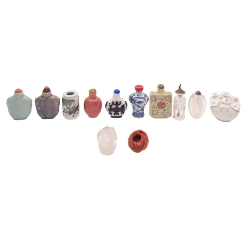 501 - A collection of Chinese glass and ceramic snuff bottles including a yellow ground famille rose bottl... 