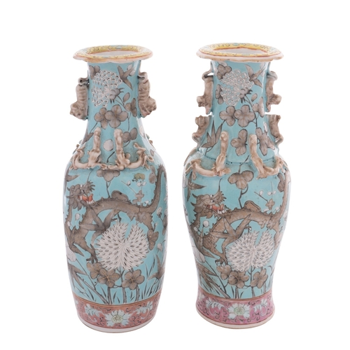 51 - A matched pair of Chinese famille rose baluster vases in Dayazhai-style, with applied lion-dog handl... 