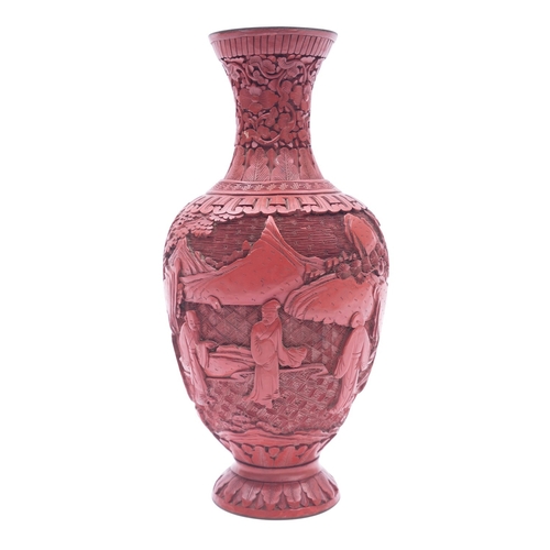 518 - A Chinese cinnabar lacquer vase, figure in a garden, late Qing Dynasty,  24cm high.