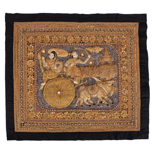 522 - A Burmese kalaga tapestry with raised decoration depicting two figures on an ox cart, inlaid with se... 