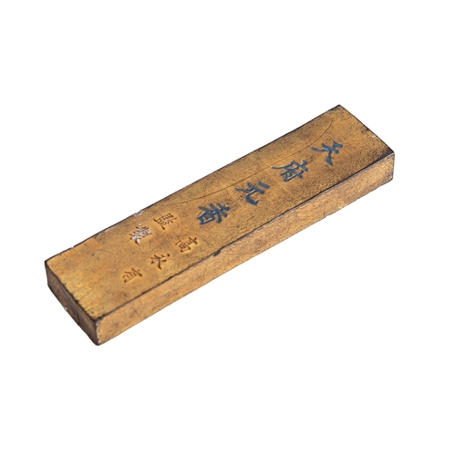 525 - A Chinese ink stick, Qing Dynasty carved with opposing dragons chasing a flaming pearl, the reverse ... 