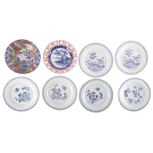 56 - Five Chinese export porcelain plates, each variously painted in blue with chrysanthemum, peony or pl... 