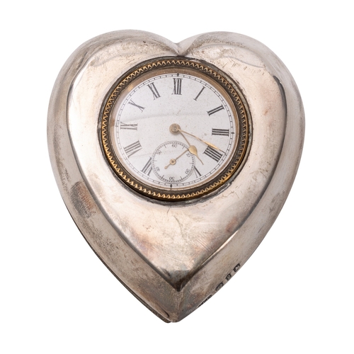 569 - A heart-shaped silver mounted easel clock having an eight-day duration timepiece movement, the white... 