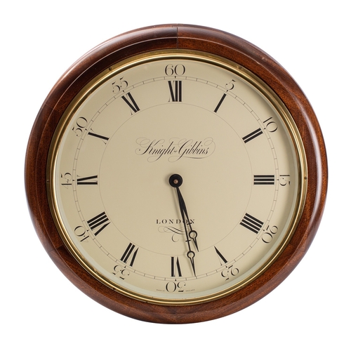 595 - A modern mahogany wall clock with quartz movement, the dial signed Knight & Gibbins, London and havi... 