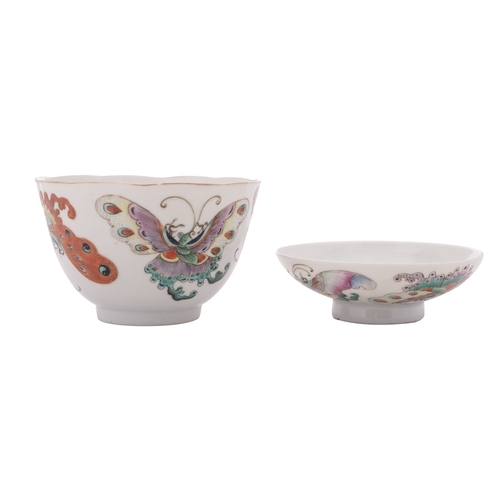 60 - A Chinese famille rose 'butterfly' cup and cover, Qing dynasty each piece painted with four large co... 