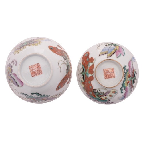 60 - A Chinese famille rose 'butterfly' cup and cover, Qing dynasty each piece painted with four large co... 