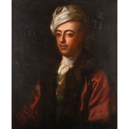 701 - Circle of Godfrey Kneller (British,1646-1723) Portrait of a gentleman, half-length, wearing a white ... 