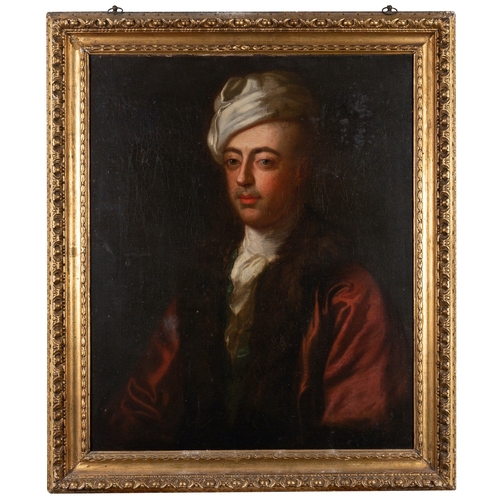 701 - Circle of Godfrey Kneller (British,1646-1723) Portrait of a gentleman, half-length, wearing a white ... 