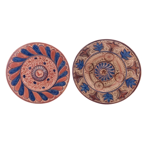 85 - Two Hispano-Moresque lustre pottery chargers both with central bosses, decorated in blue and copper ... 