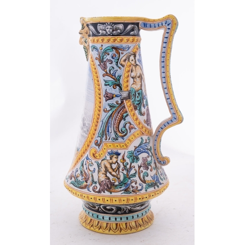 92 - A French polychrome faience jug, painted with an oval panel depicting a soldier in armour and verso ... 