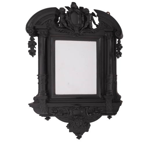 932 - An Italian carved and ebonised wood framed wall mirror in Baroque style, 20th century; with armorial... 