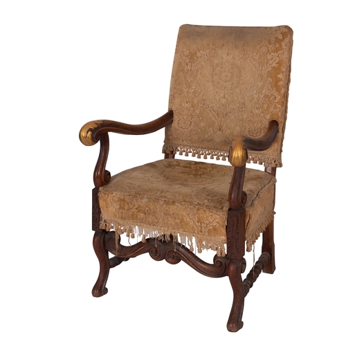 942 - A carved walnut and upholstered elbow chair in William and Mary style, late 19th century; with recta... 