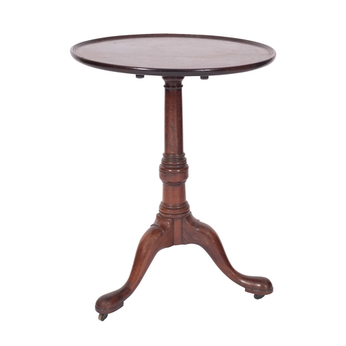 956 - A George II mahogany circular occasional table, mid 18th century; the flip-top with moulded edges, o... 