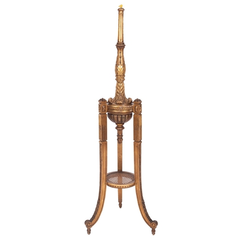 972 - A carved and giltwood standard lamp in 18th century taste, 20th century; with fluted and foliate car... 