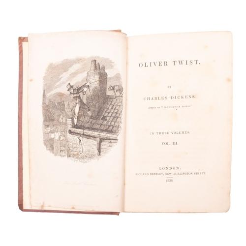 113 - DICKENS, Charles. Oliver Twist , London: Richard Bentley 1838, first book edition, 3 vols, illustrat... 