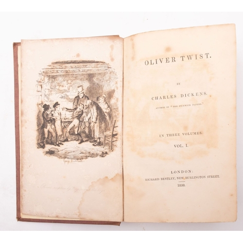 113 - DICKENS, Charles. Oliver Twist , London: Richard Bentley 1838, first book edition, 3 vols, illustrat... 