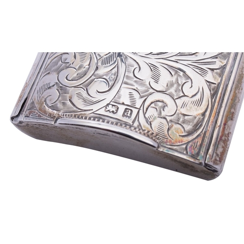 129 - A Victorian silver vesta case by E T, Birmingham 1900, of concave rectangular form, with sliding lid... 