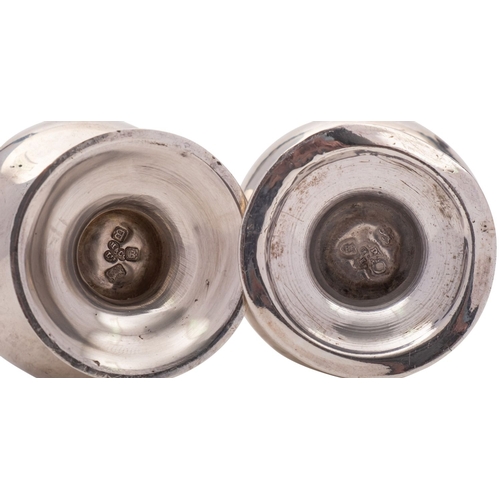 150 - A pair of George VI silver caster by Hamilton & Co of Calcutta, London 1937, in the George III style... 